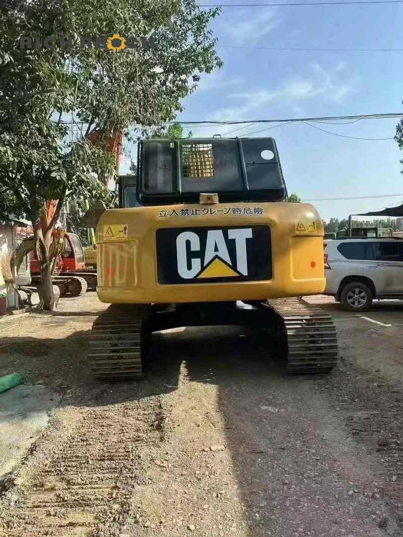 Front view of a 2010 Caterpillar 320D excavator with 2,300 hours, priced at $18,056